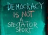 Image saying "Democracy is not a spectator sport"